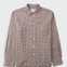 A long-sleeve button-up shirt with a small-scale brown and white checkered pattern, featuring a classic collar, white buttons, and a chest pocket, displayed against a light gray background.