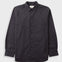 Textured brown striped shirt laid flat against a grey backdrop