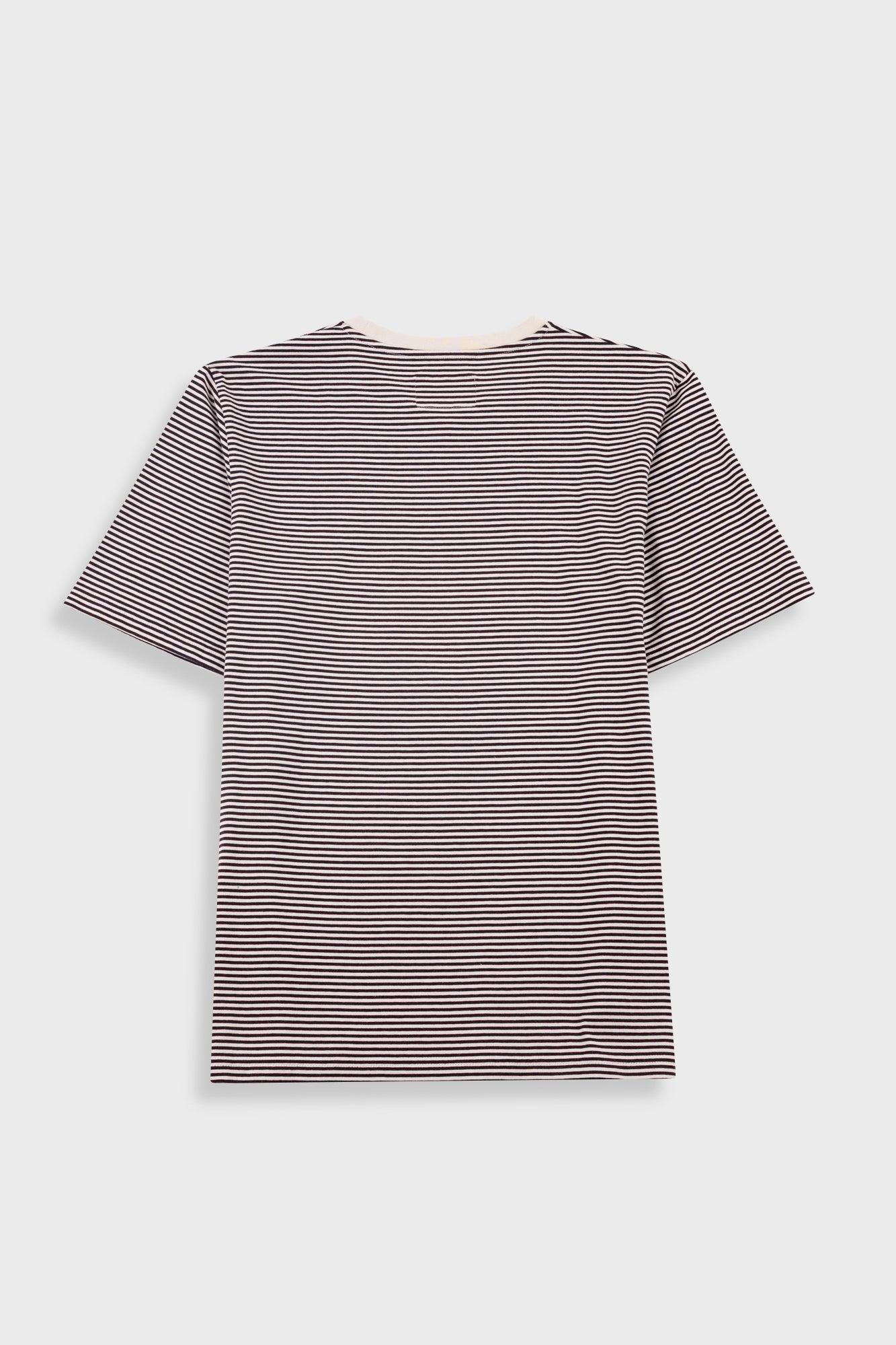 Black and white striped shirt with a visible brand label on a light background