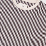 Black and white striped shirt with a visible brand label on a light background