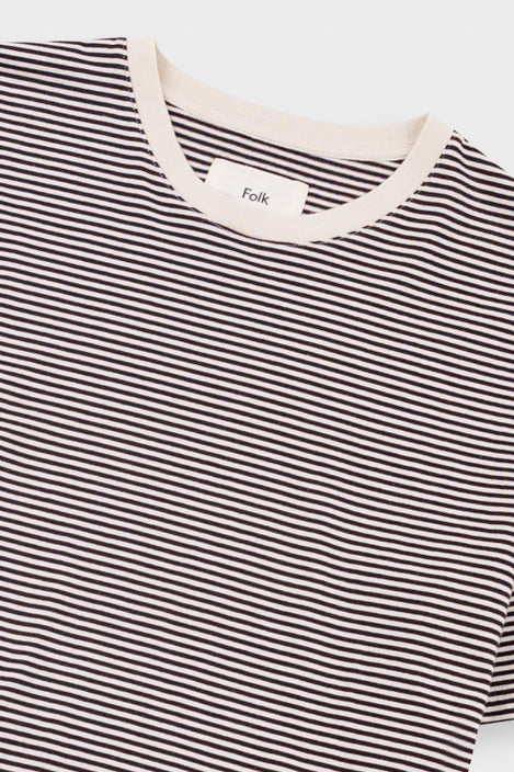 Black and white striped shirt with a visible brand label on a light background