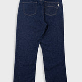 Back view of dark blue jeans on a white background