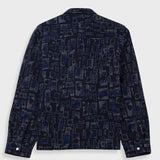 Dark blue patterned shirt on a light gray background