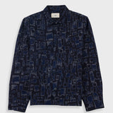 Navy patterned shirt on a light gray background