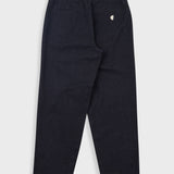 Black pants with a small white logo on a light gray background