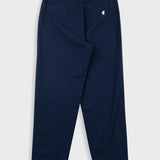 Navy blue pants with a small white logo on a light gray background