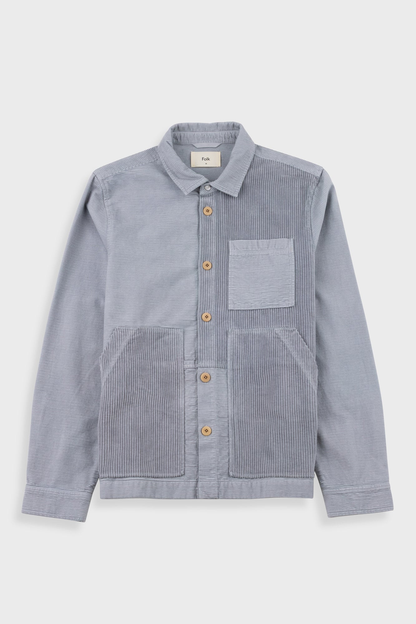 Gray corduroy shirt with button details on a white background