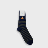 A single navy blue sock with dark green horizontal stripes and a small orange and white graphic near the cuff, shown on a light gray background.