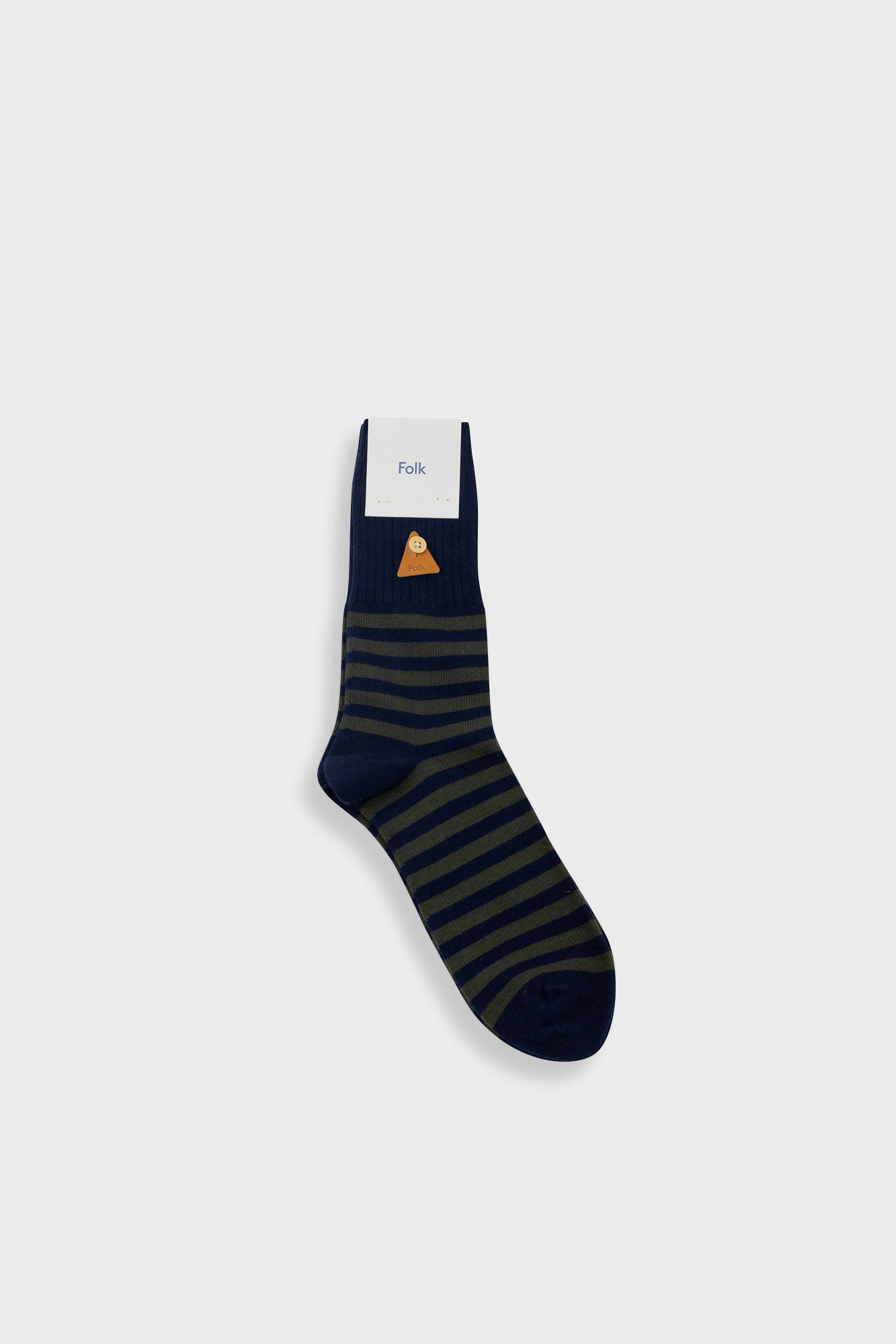 A single navy blue sock with dark green horizontal stripes and a small orange and white graphic near the cuff, shown on a light gray background.