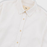 White button-up shirt with collar on a light gray background