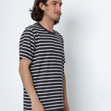 Man wearing a striped shirt against a white background