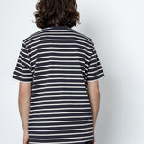 Person wearing a striped shirt against a white background