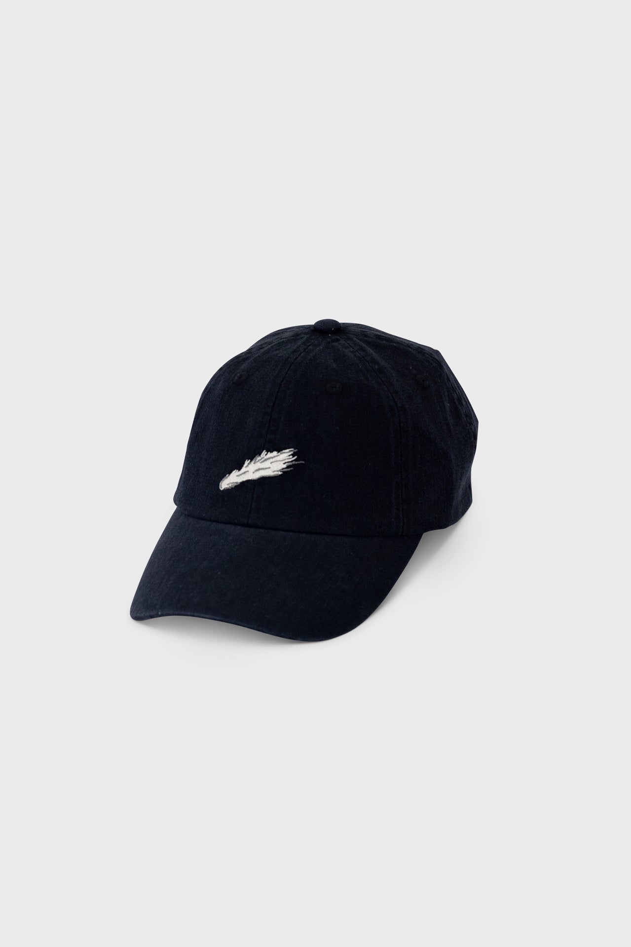 A black baseball cap with a white comet detail.