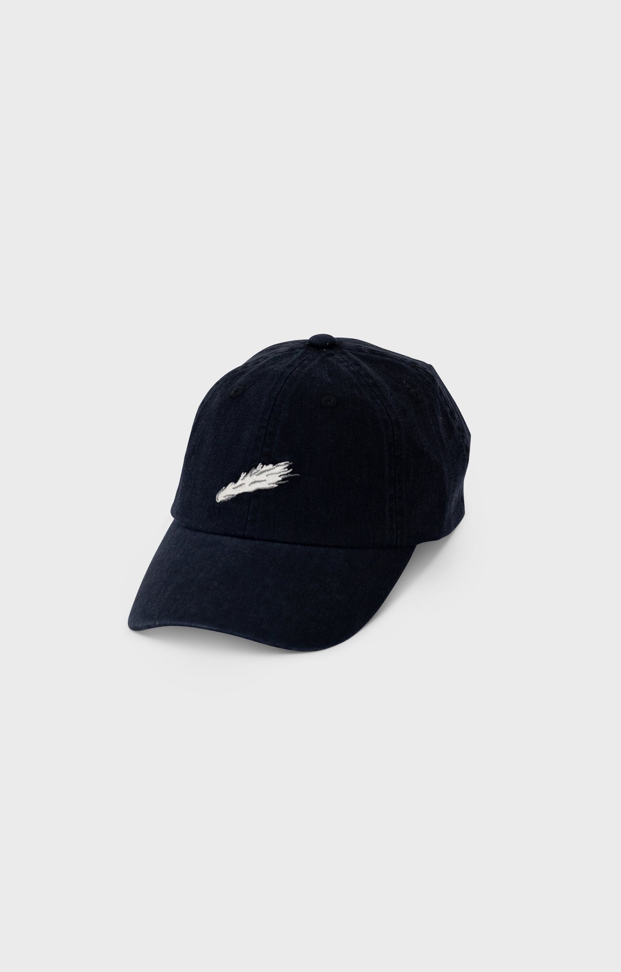 A black baseball cap with a white comet detail.