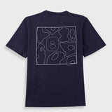A navy blue short-sleeve t-shirt shown from the back, featuring a white abstract line-art graphic with the number 8 in the center, displayed against a light gray background.