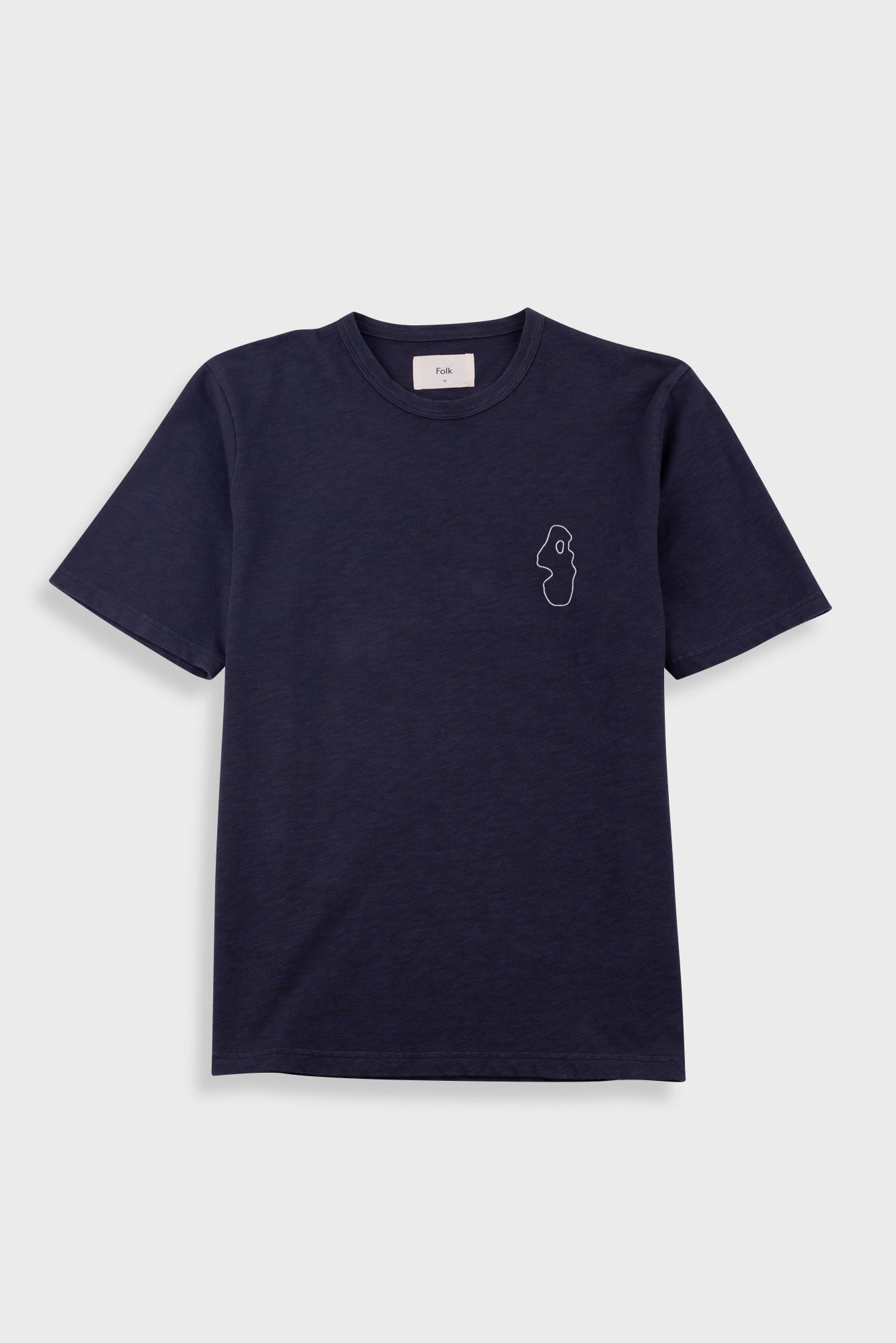 A navy blue short-sleeve crewneck t-shirt with a small white line-art graphic on the left chest, displayed flat against a light gray background.