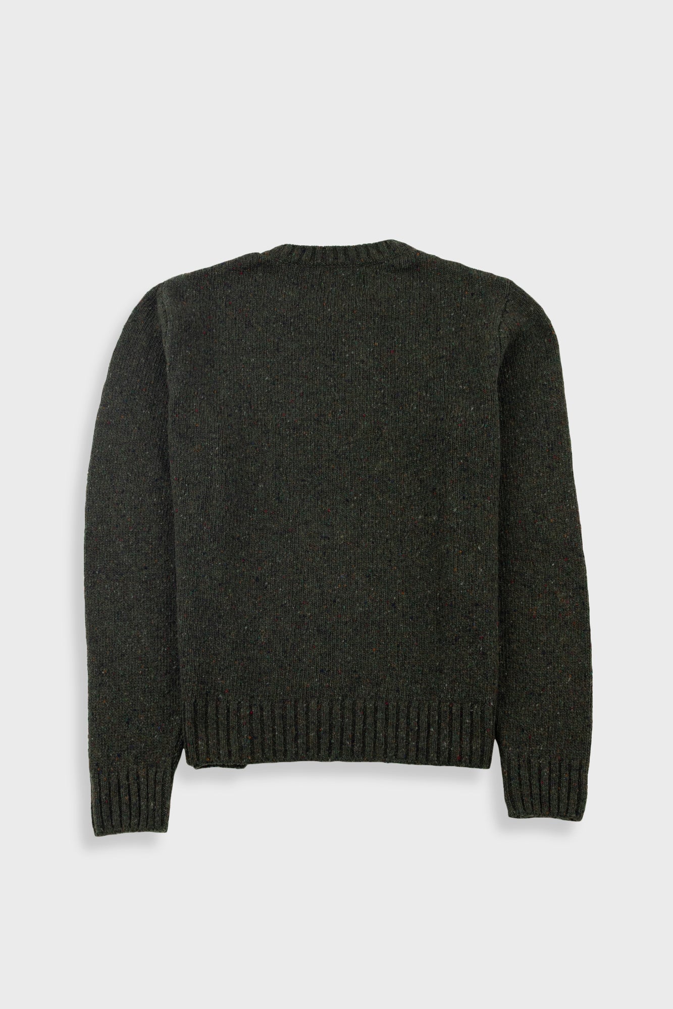 Dark green sweater on a light gray background