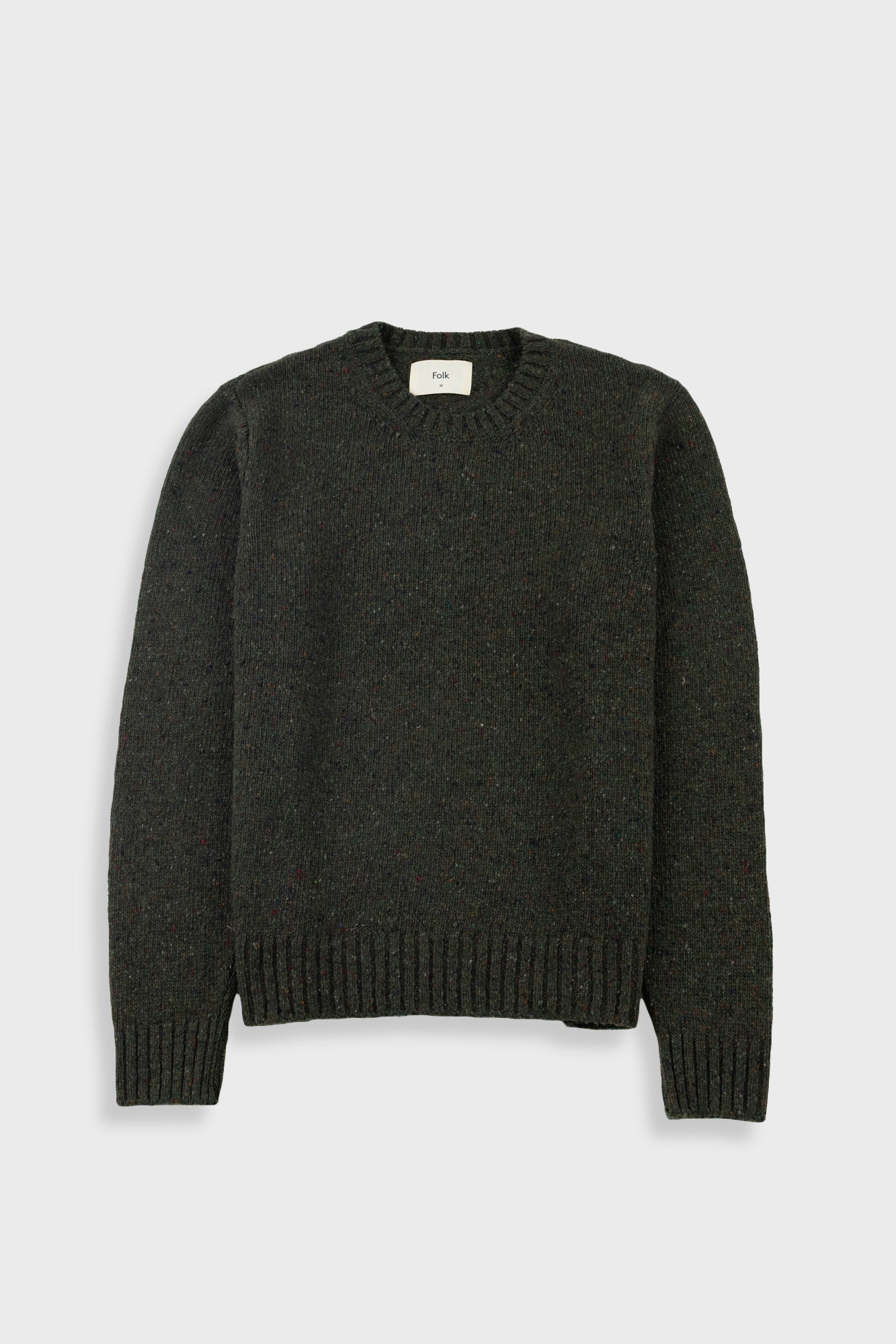 A dark olive green knitted sweatshirt against a light grey background.