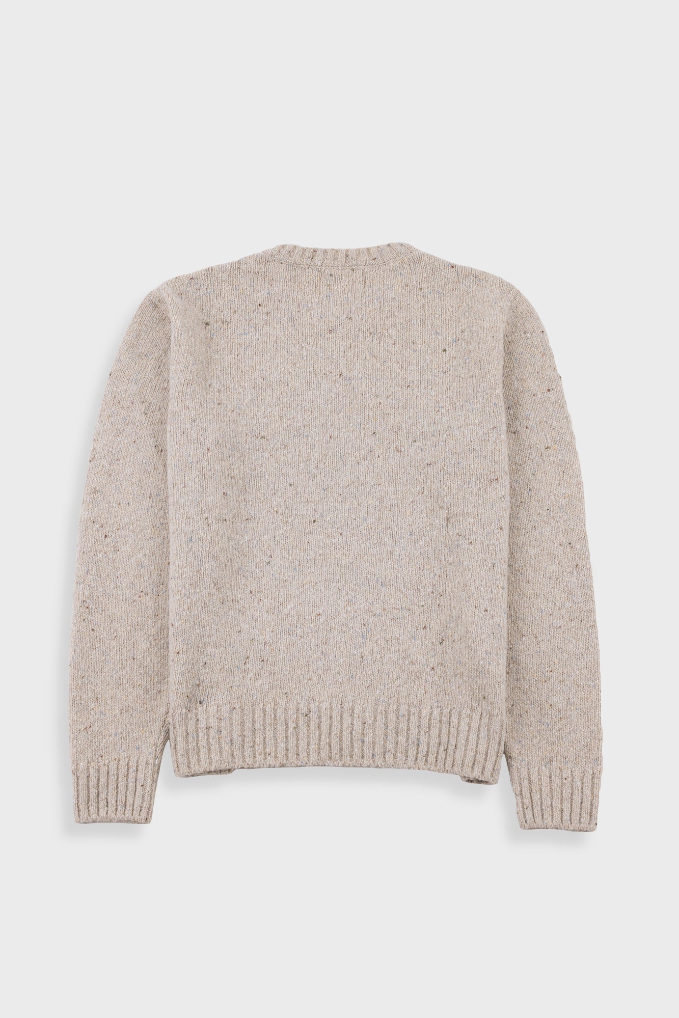 Beige knitted sweater on a white background