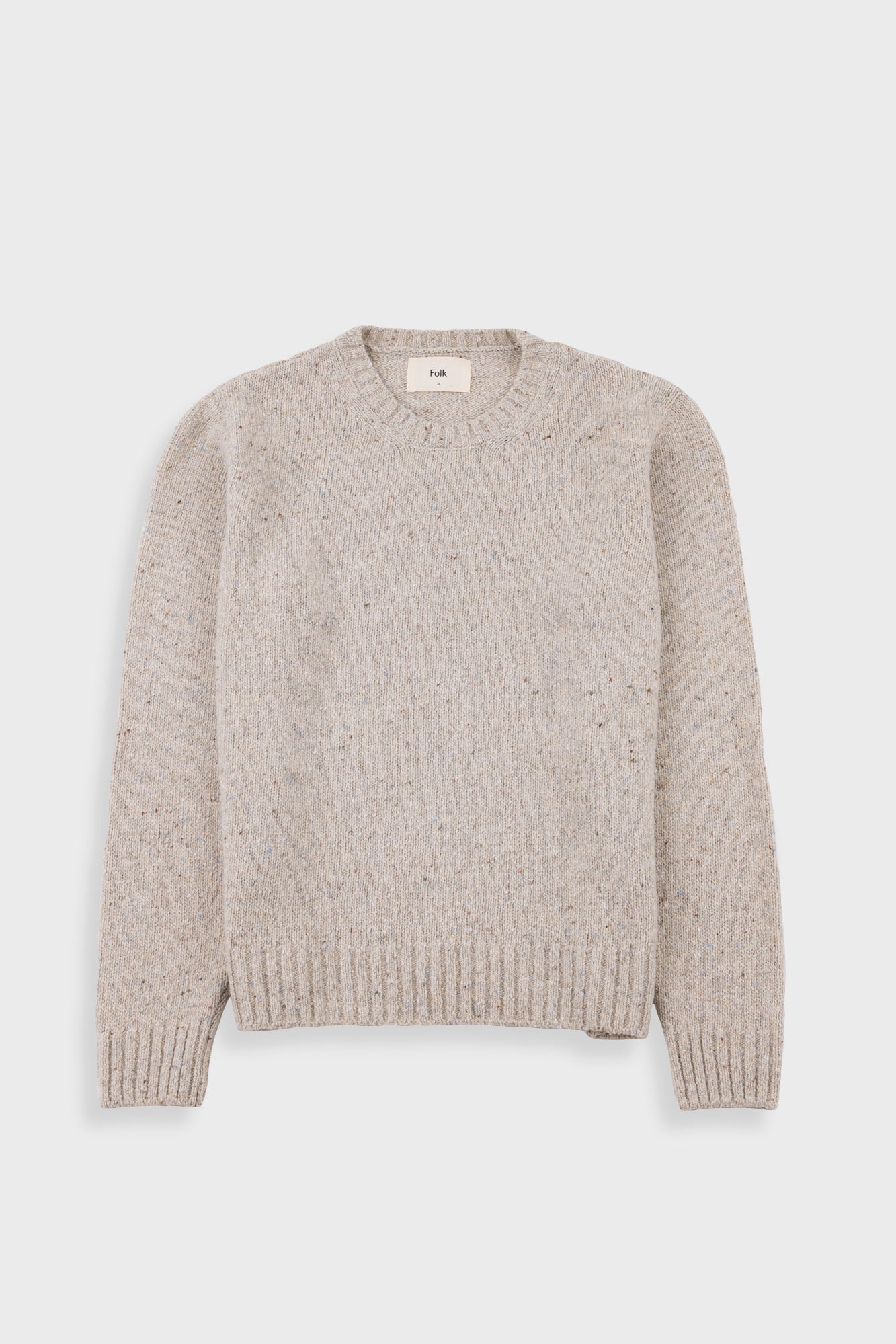 Beige sweater on a white background