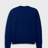 Blue sweater on a light gray background
