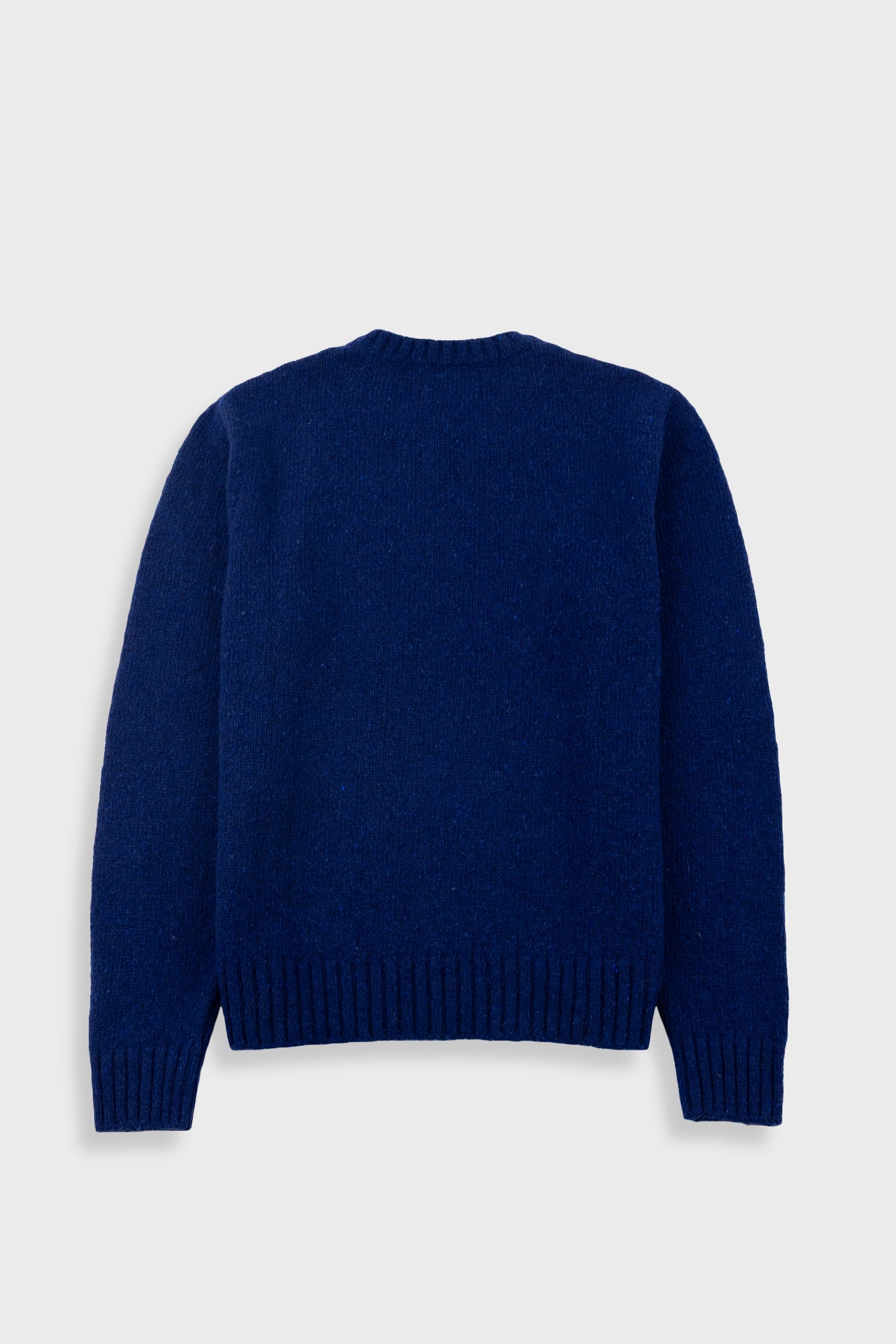 Blue sweater on a light gray background