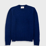 Blue sweater on a light gray background