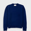 Blue sweater on a light gray background
