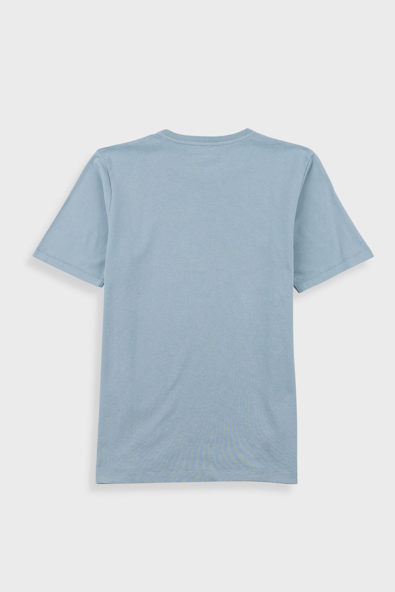 Close-up of a light blue crewneck t-shirt with a white neck label reading 'Folk'.