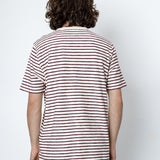Person wearing a striped shirt against a white background