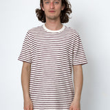 Man wearing a striped t-shirt against a white background
