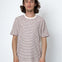 Man wearing a striped t-shirt against a white background