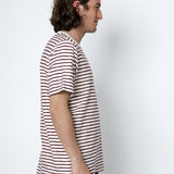 Man wearing a striped t-shirt against a white background