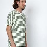 Man wearing a striped shirt against a white background