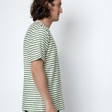 Man wearing a striped shirt against a white background