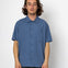 Man wearing a blue short-sleeve shirt against a white background