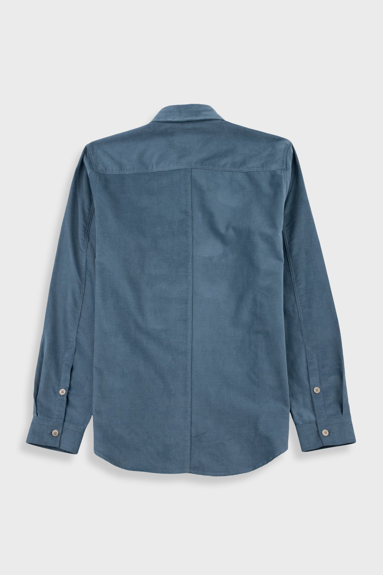 A slate blue long-sleeve button-down shirt shown from the back, featuring a central seam and button cuffs, displayed on a light gray background.