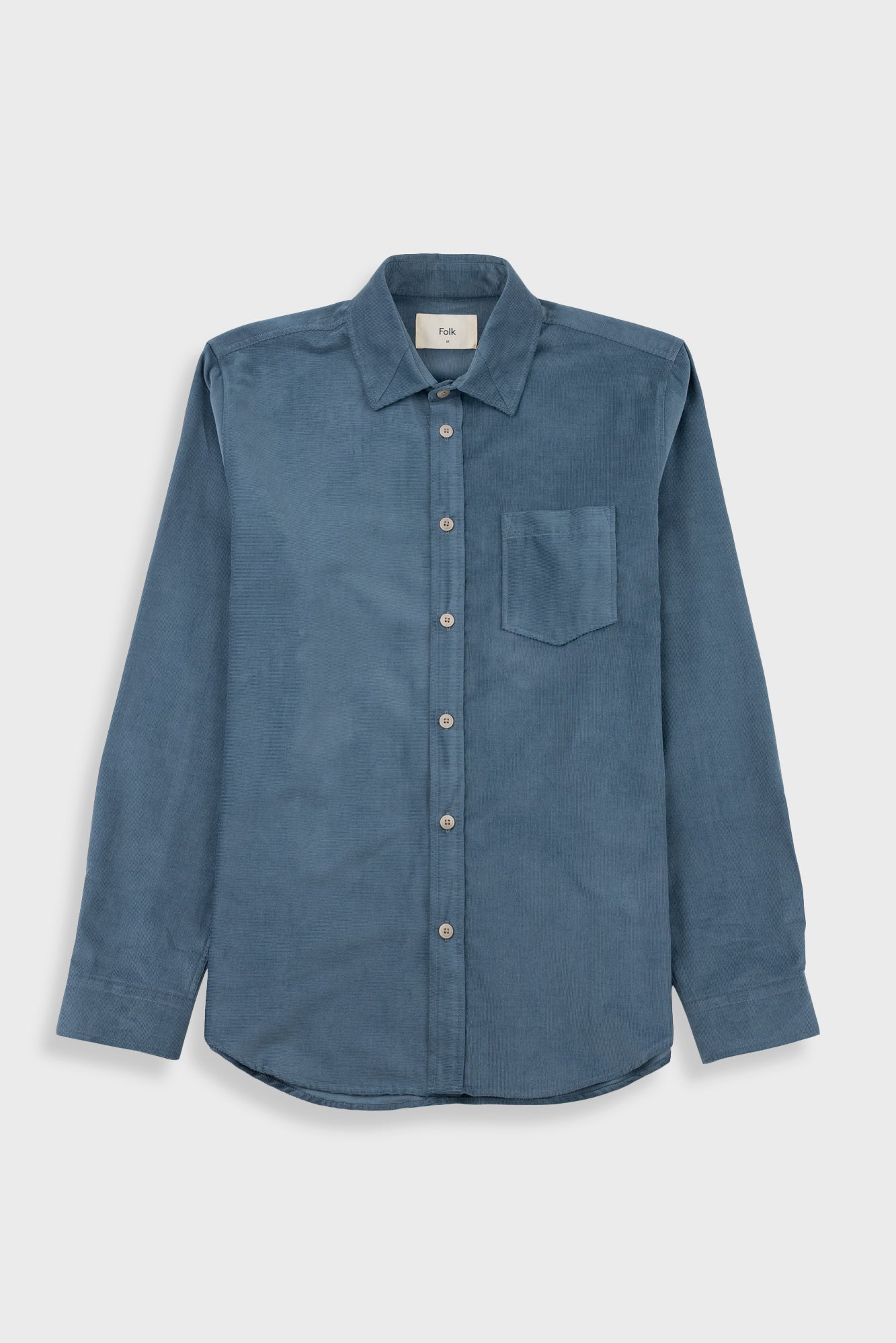 A blue long-sleeve button-up shirt with a single chest pocket, displayed flat against a light gray background.