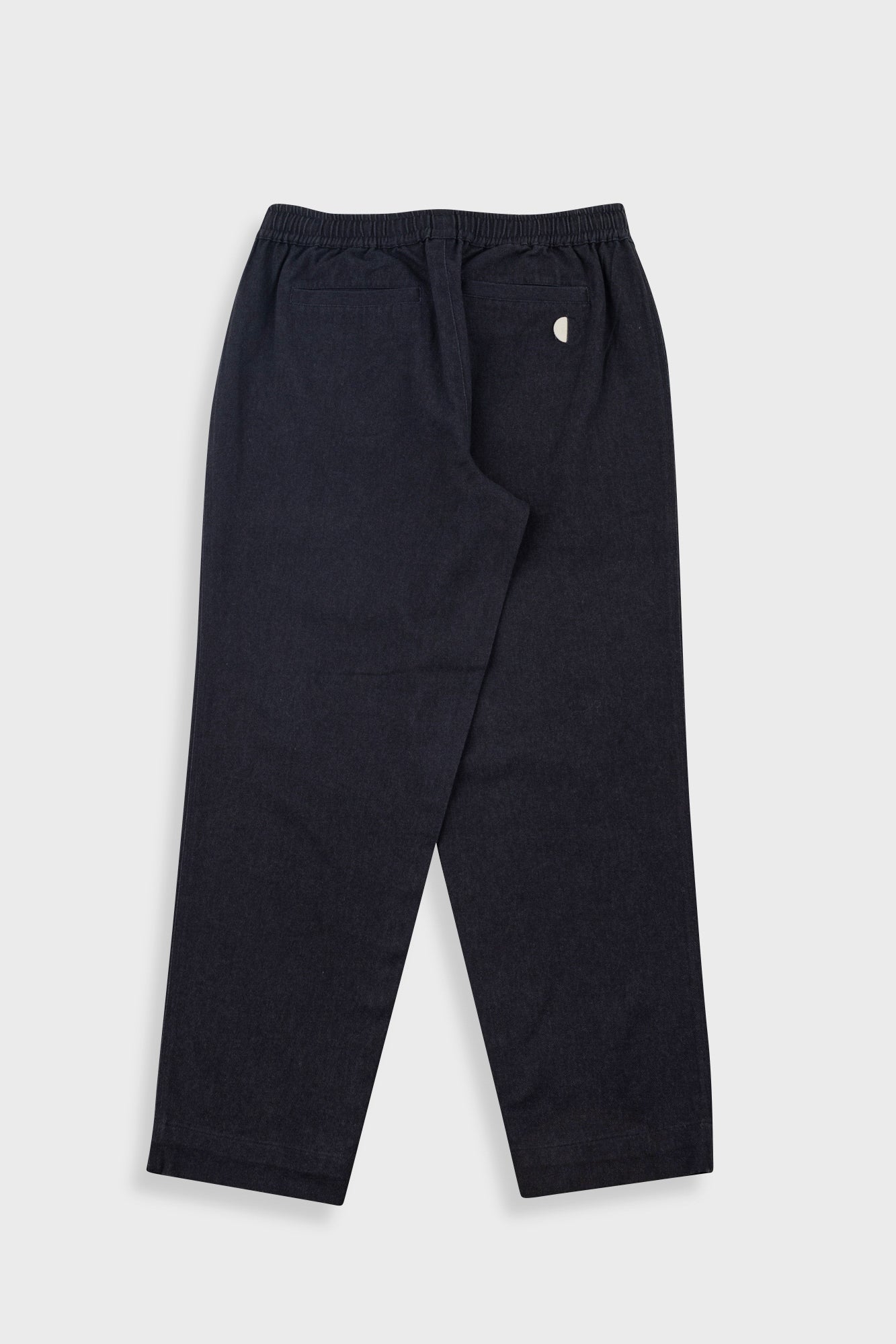 Dark navy blue jogger pants with an elastic waistband and a small white embroidered logo on the left hip, shown flat against a light gray background.