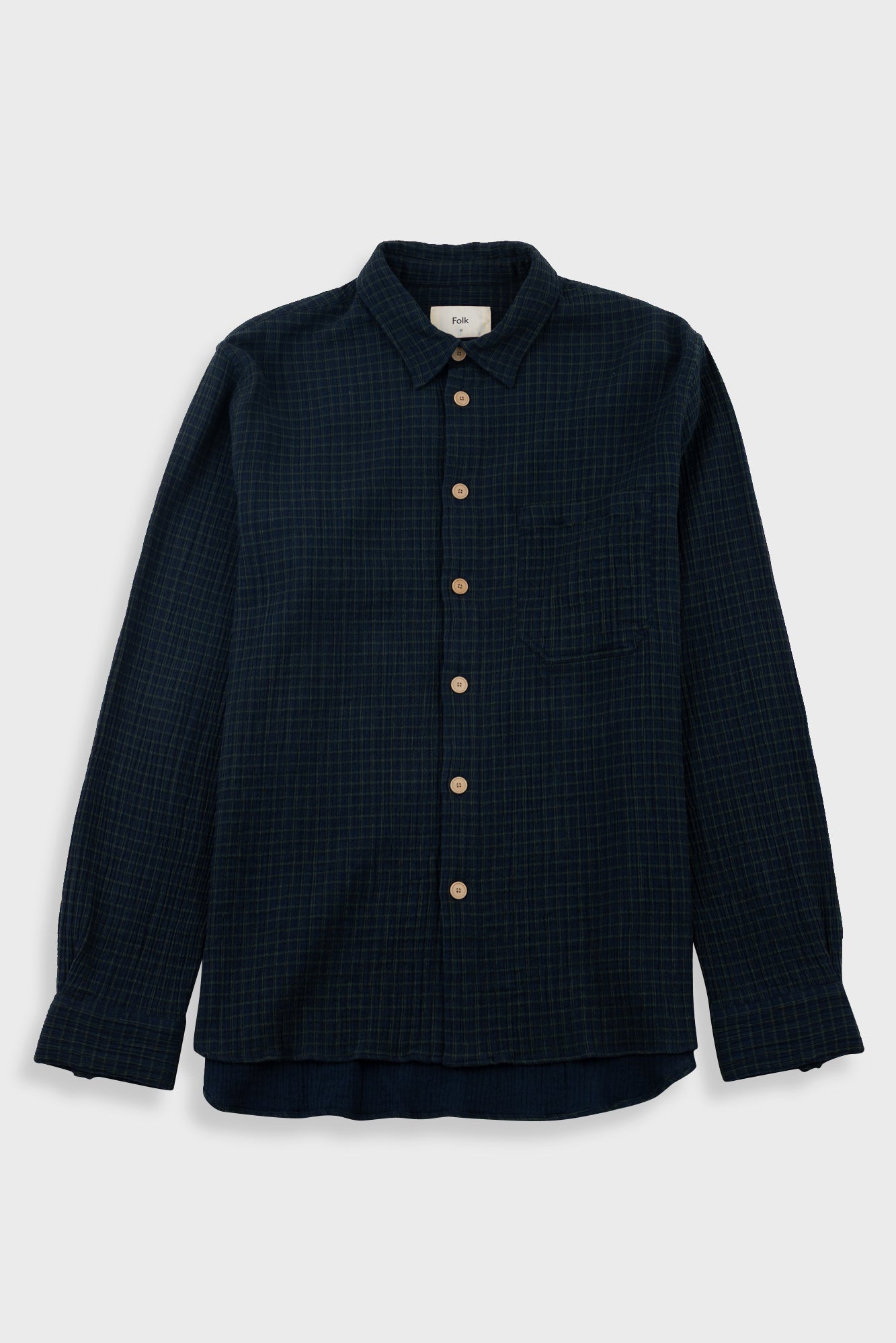 Navy checkered shirt on a white background