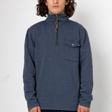 Man wearing a blue pullover with a zipper on a white background