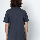 Person wearing a dark gray t-shirt against a white background