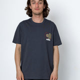 Person wearing a navy blue t-shirt with a small graphic on a white background