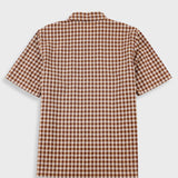 A short-sleeve button-up shirt with a brown and beige gingham check pattern, shown from the back on a light gray background.
