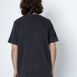 Person wearing a black t-shirt and pants against a white background