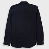 A dark navy blue long-sleeve button-up shirt shown from the back, laid flat against a light gray background.