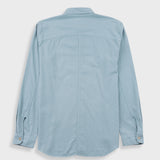 A light blue long-sleeve button-up shirt shown from the back, laid flat against a light gray background.