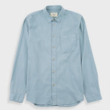 A light blue long-sleeve button-up shirt with a single chest pocket, laid flat against a light gray background.