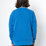 Person wearing a blue sweatshirt on a white background