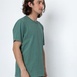 Man wearing a green t-shirt against a white background